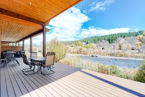 Image of Beautiful waterfront townhome w\/ river & mountain views