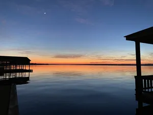 Image of Amazing sunsets at a lake front luxury home.