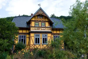 Image of Landhaus Kunterbunt at the forest and river with chicken and sheep in the Thuringian Forest
