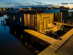 Image of Comfortable, large, moored houseboat