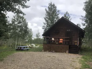 Image of Bear Bait Cabin is cozy and rustic overlooking beautiful aspen trees