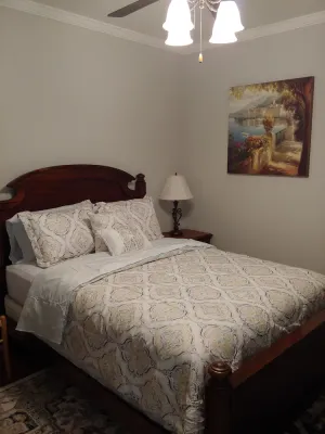 Image of Cozy bedroom with private bathroom, and separate, direct access entrance.