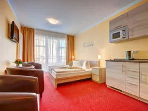 Image of Comfort Room with Kitchenette - Aparthotel Strandhus Trivago Award \"Best 3-star hotel\"