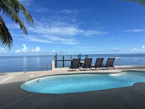 Image of Tropical: 4BR Luxury Home Gulf Views Pool and Dock