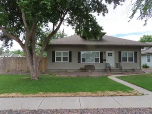 Image of Spacious Heart of Loveland Bungalow with swingset and large yard