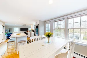 Image of Sunny, Cape-style home with a game room, yard, firepit, & washer\/dryer