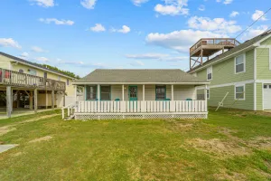 Image of Charming coastal home with a large yard, firepit, & outdoor shower
