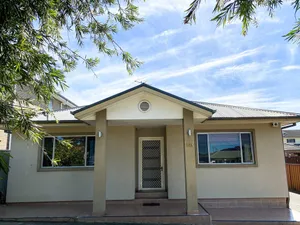 Image of This one storey house has 5 bedrooms and 2 full bathrooms