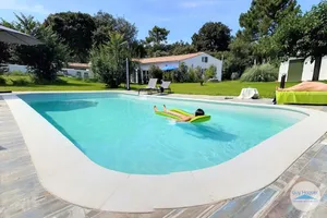 Image of 2 gites in a green setting