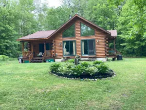 Image of A Beautiful Log Cabin In The Woods, On Pontoosuc Lake, Yet Near Everything