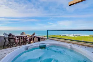 Image of Large oceanfront home with hot tub, shared pool, & large deck - dogs welcome