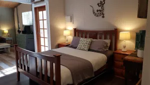 Image of Adorable Guest House with fireplace in forest setting. One or two Queen Beds.