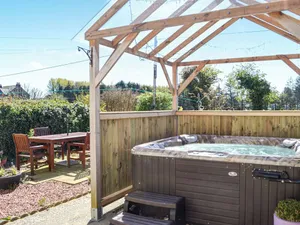 Image of Where better to enjoy the hot tub in this delightful and private garden.