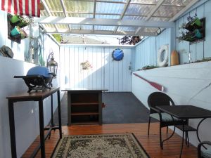 Image of PORTHOLE:  Peaceful with a private, locked, covered patio to relax\/ store bikes.