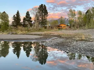 Image of Island House on Yellowstone River with beach and fishing out back door: