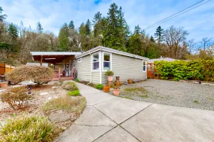 Image of Dog-friendly riverfront home with patio, golf nearby, enclosed yard, & W\/D