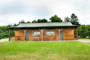 Image of 1\/2 of a double cabin with two queen beds (sleeps 4).