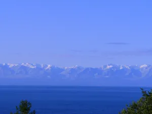 Image of Spectacular West side views of Strait, Olympics, Victoria, south to Mt Rainier.
