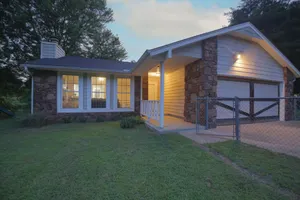 Image of Urban Wilderness Home on Full Acre close to shopping and Hwy