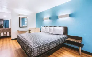 Image of Blue Way Inn & Suites Beeville-Deluxe 1 King Bed with Kitchenette NS