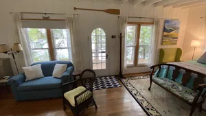 Image of The Wee White Cottage on Tripp Lake in Poland, Maine.