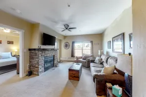 Image of Ski-in\/ski-out condo with gas fireplace, shared hot tub, pool, & mountain views