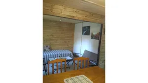Image of Campos de Dios Cabin between streams and mountains