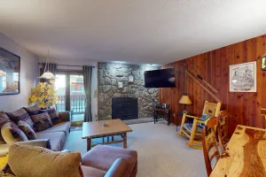 Image of 2nd-floor condo with balcony, fast WiFi, fireplace & shared W\/D