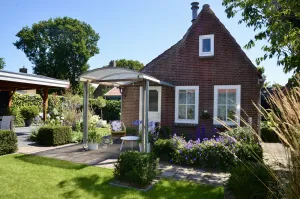 Image of SCHOORL: Pretty little holiday house with a beautiful garden and covered veranda.
