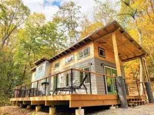 Image of Walk to State Park Trails! Modern cabin surrounded by woods + hot tub + firepit
