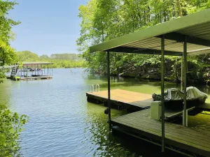 Image of Family friendly lake front home with private dock in a cove