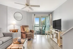 Image of Second-floor villa w\/ river views & community pool, tennis courts, and dock