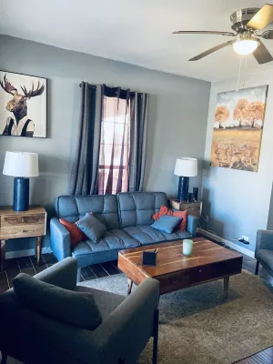Image of Modern and Cozy Apartment with large windows and sunlight.