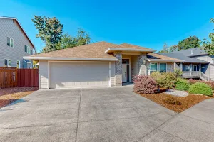 Image of Custom-built home alongside greenspace with deck & massage chairs
