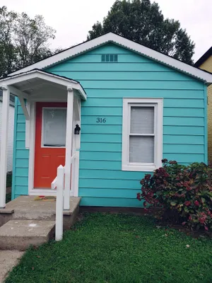 Image of The Wee House is a shotgun house that is remodeled with a view of the Ohio river
