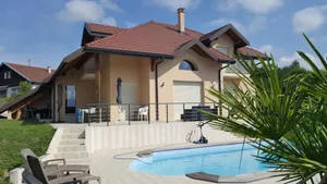 Image of large swimming pool with large sun terraces