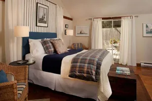 Image of Plan Your Escape to the Cottage! Minutes to Mystic, Connecticut. This pet-friendly retreat has a private fenced-in rear garden patio. Your stay includes organic breakfast, firepit, hammock, and onsite hiking trails. Up to 2 well-behaved pets welcome!