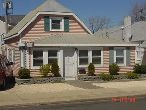 Image of Large home two floors with upper deck area.