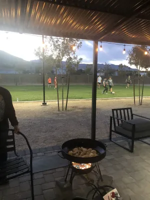 Image of Modern container home in Las Vegas with own soccer field and trees.