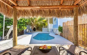 Image of Key West style waterfront home w\/ private pool, modern decor and prime location