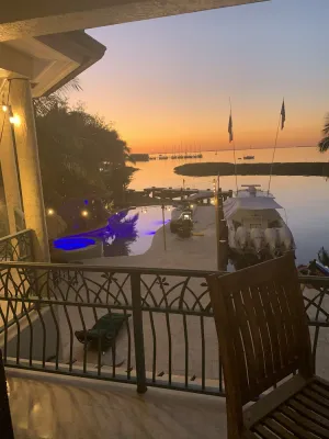 Image of House and guest house with Boat dock, sunsets, jacuzzi, pool, slide, tiki, etc