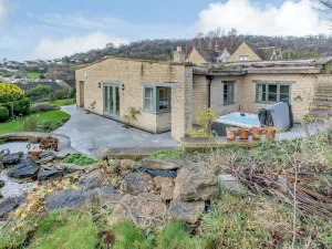 Image of Perched attractively on its hill, Coach House Cottage overlooks the enchanting valley beneath.