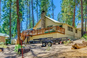 Image of Cozy cabin in the trees with deck, grill, wood-burning fireplace, WiFi, & W\/D