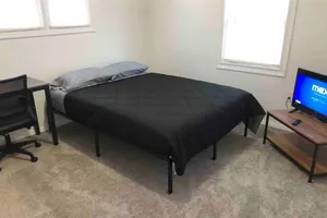Image of Private 2-bed house with free parking and 15-min walk to direct NYC Manhattan train