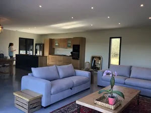 Image of New stone and wood house with swimming pool