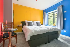 Image of Unique apartment with private kitchen and bathroom inspired by the art of Bart van der Leck.