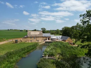 Image of 16th century converted mill in the Cotswolds with a hot tub -Little Barford Mill