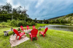 Image of Classic log cabin near skiing on pond with mountain views & deck - dog-friendly