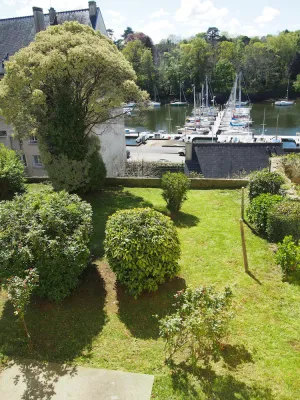 Image of apartment overlooking garden and sailboats