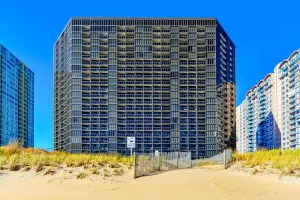 Image of Classy beachfront studio with balcony, full kitchen, AC, W\/D, pools & gym